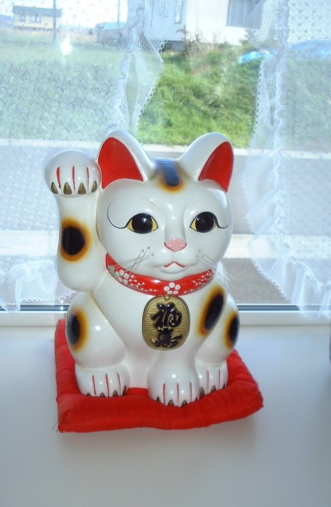 Japanese maneki-neko, a cat figurine thought to bring good fortune.